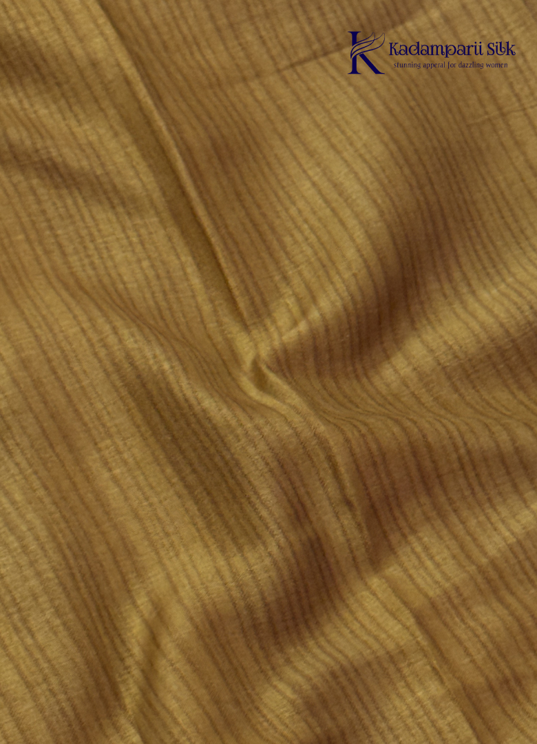 Kadamparii Silk cream semi tussar silk saree with mustard purple floral print and mustard border, displayed on a white background.