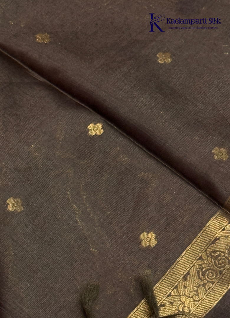 Kadamparii Silk mint green raw silk saree with floral zari border and subtle zari detailing, displayed on a white background.