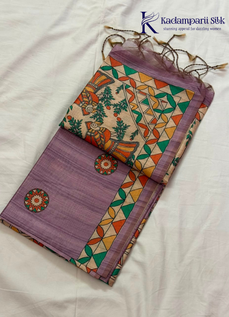 Kadamparii Silk lavender semi tussar silk saree with artistic printed mundhi, floral leaf motifs, and multicolour border, displayed on a white background.