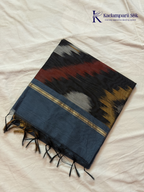 Kadamparii Silk blue Pochampally silk cotton saree with bold ikat geometric patterns, golden zari border, soft lightweight fabric, elegant tassels, and traditional handloom-inspired ethnic design.