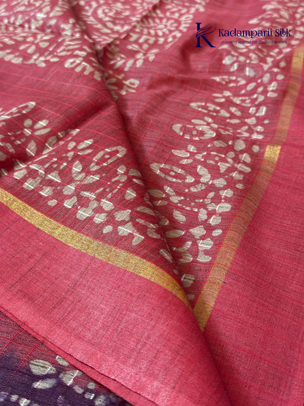 Blush pink semi tussar saree with traditional batik print and purple contrast pallu by Kadamparii Silk.