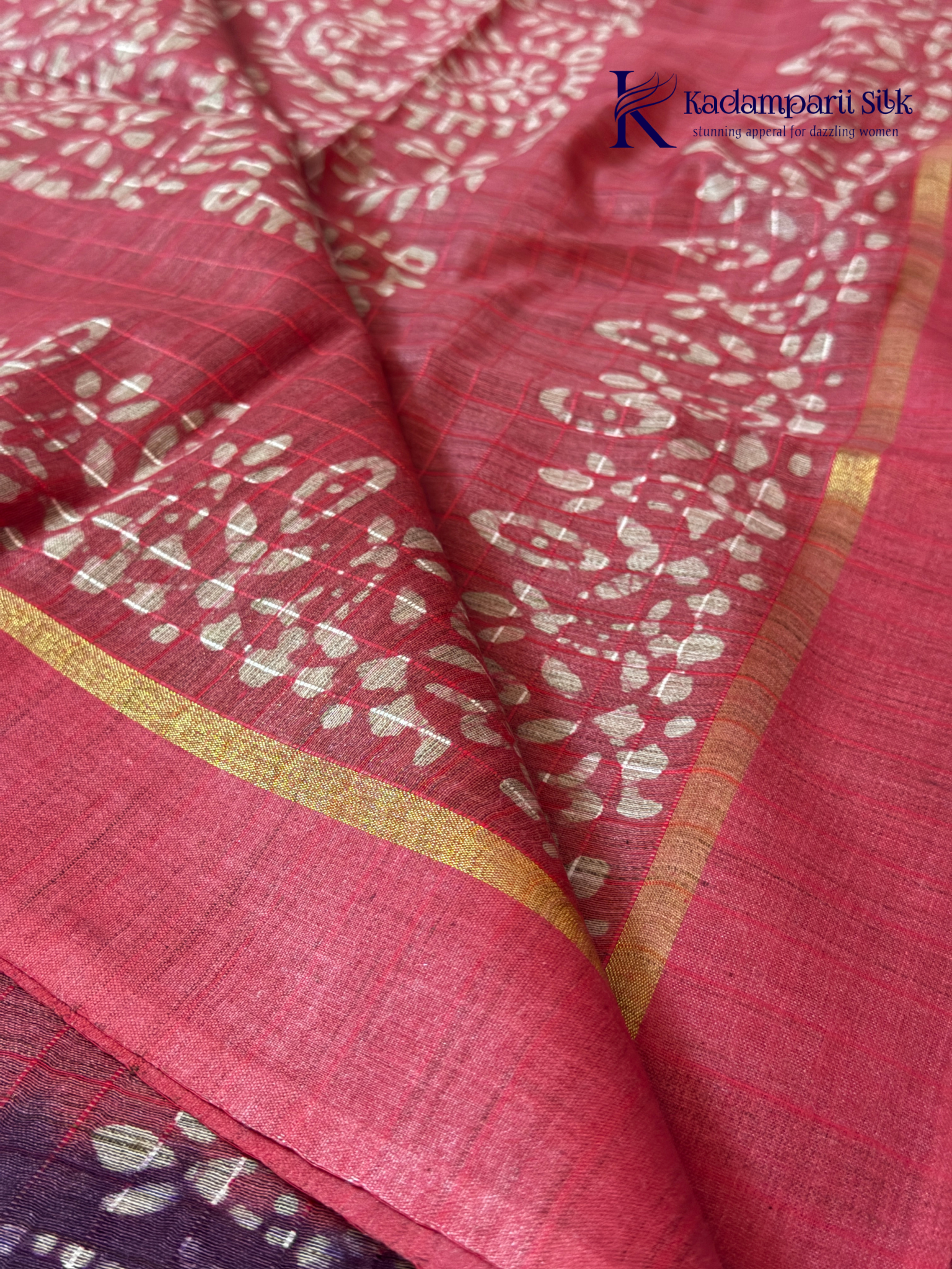 Blush pink semi tussar saree with traditional batik print and purple contrast pallu by Kadamparii Silk.