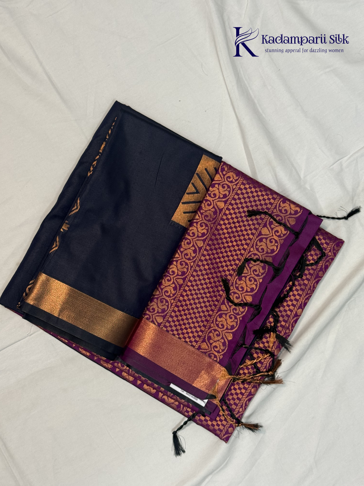 Kadamparii Silk navy blue semi soft silk saree with vibrant magenta zari woven pallu, intricate checkered motifs, copper gold zari border, and elegant tassel detailing.