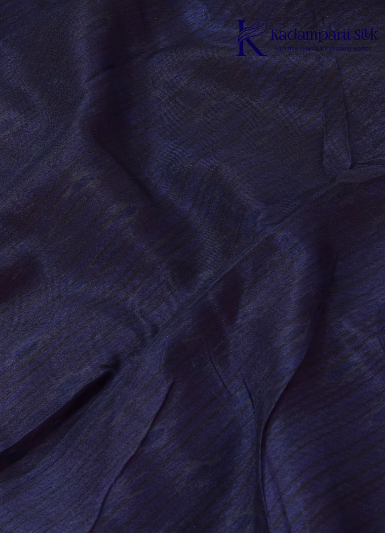 Kadamparii Silk maroon soft semi tussar silk saree with woven pattern and navy blue contrast border, displayed on a white background.