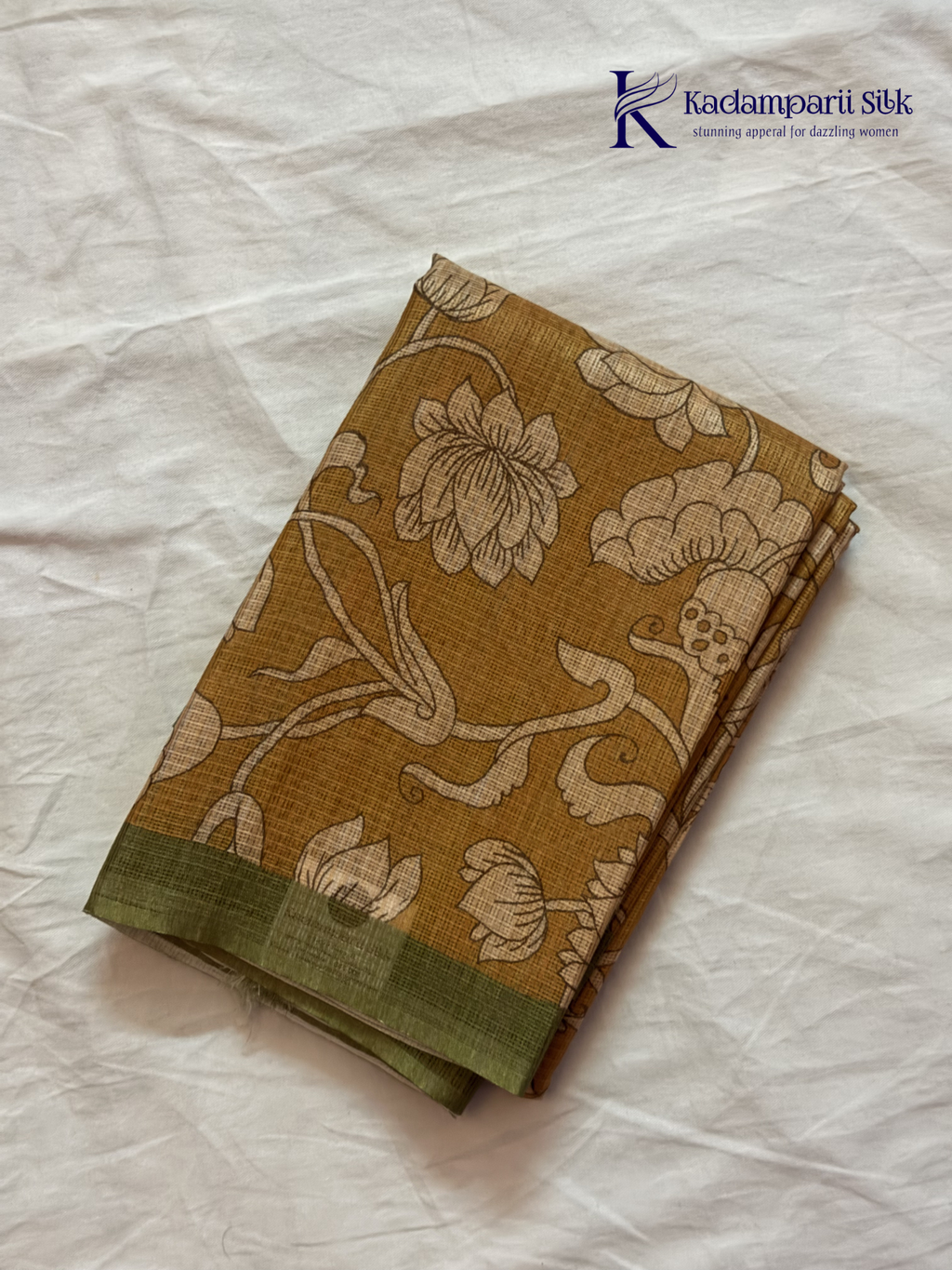 Mustard kota silk saree with floral Kalamkari print and contrast border by Kadamparii Silk.