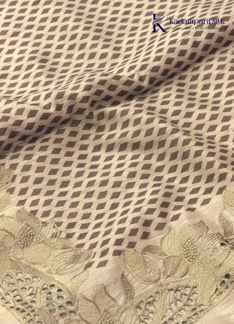 Kadamparii Silk beige tussar silk saree with woven body pattern and detailed cutwork border, displayed on a white background.
