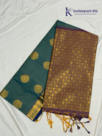 Kadamparii Silk teal blue semi soft silk saree with gold zari motifs, rich purple checkered zari pallu, ornate woven border, royal blue accents, and tassel detailing.
