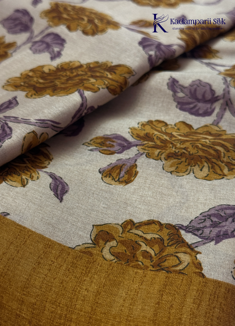 Kadamparii Silk cream semi tussar silk saree with mustard purple floral print and mustard border, displayed on a white background.