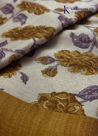 Kadamparii Silk cream semi tussar silk saree with mustard purple floral print and mustard border, displayed on a white background.
