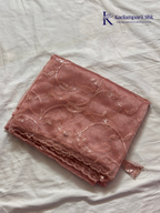 Rose pink shimmer silk saree with elegant sequin embroidery, soft shimmer texture, scalloped border detailing, lightweight flowy fabric, and glamorous partywear styling by Kadamparii Silk.