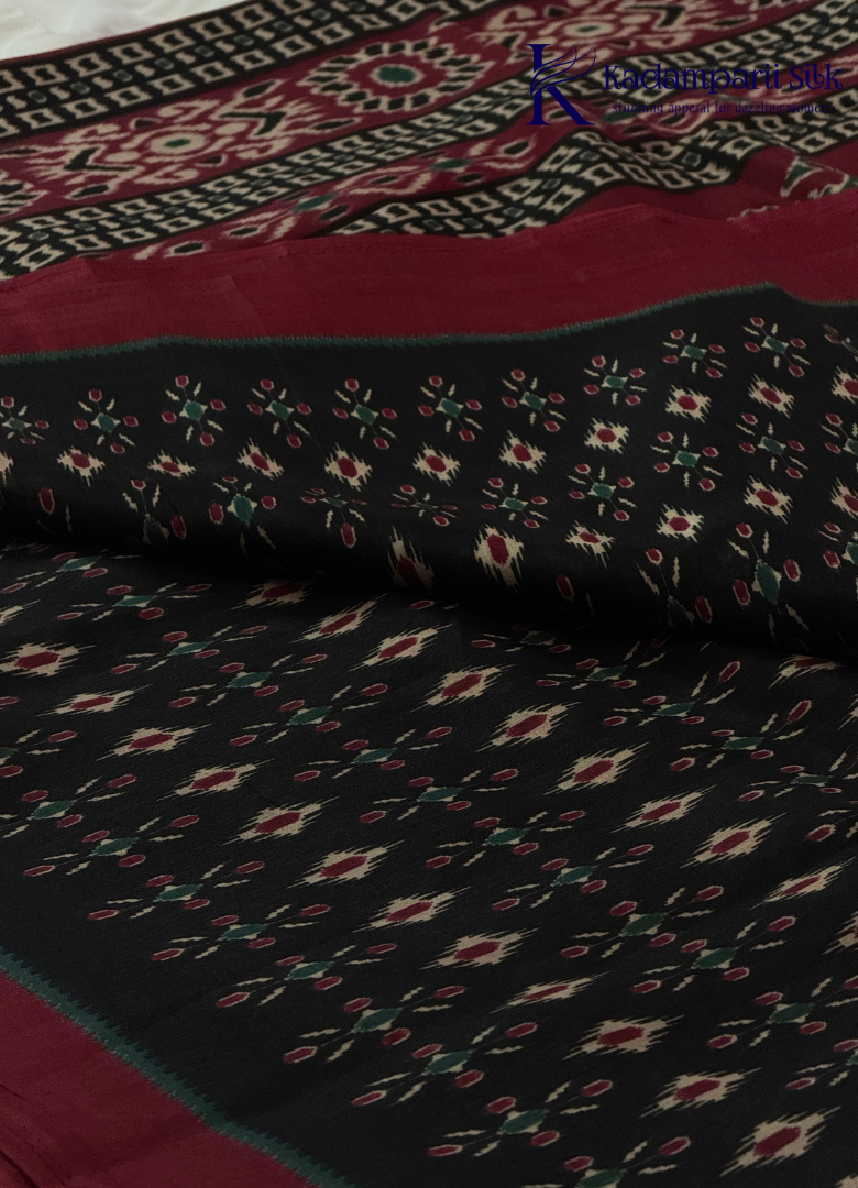 Kadamparii Silk black soft semi tussar silk saree with woven pattern and contrast border, displayed on a white background.