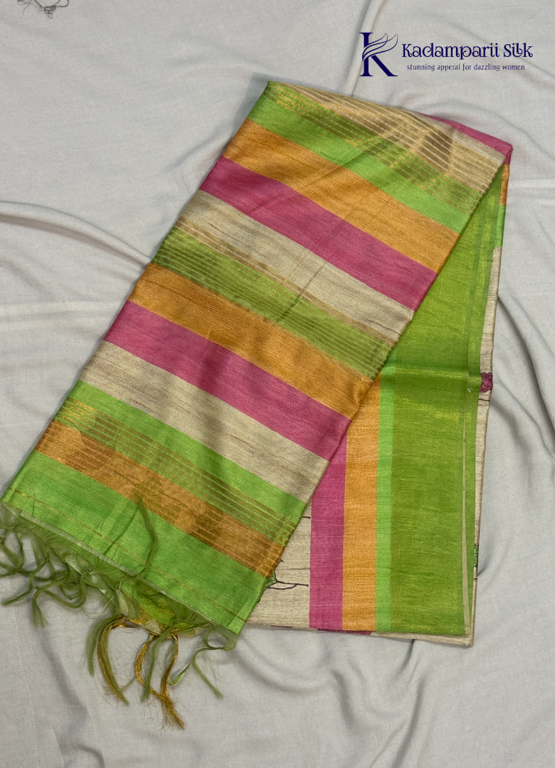 Drape yourself in this Soft Tussar Silk Saree, featuring a graceful botanical leaf print on a subtle beige body, complemented by a vibrant multicolor contrast border. Lightweight, elegant, and effortlessly stylish—perfect for every occasion.