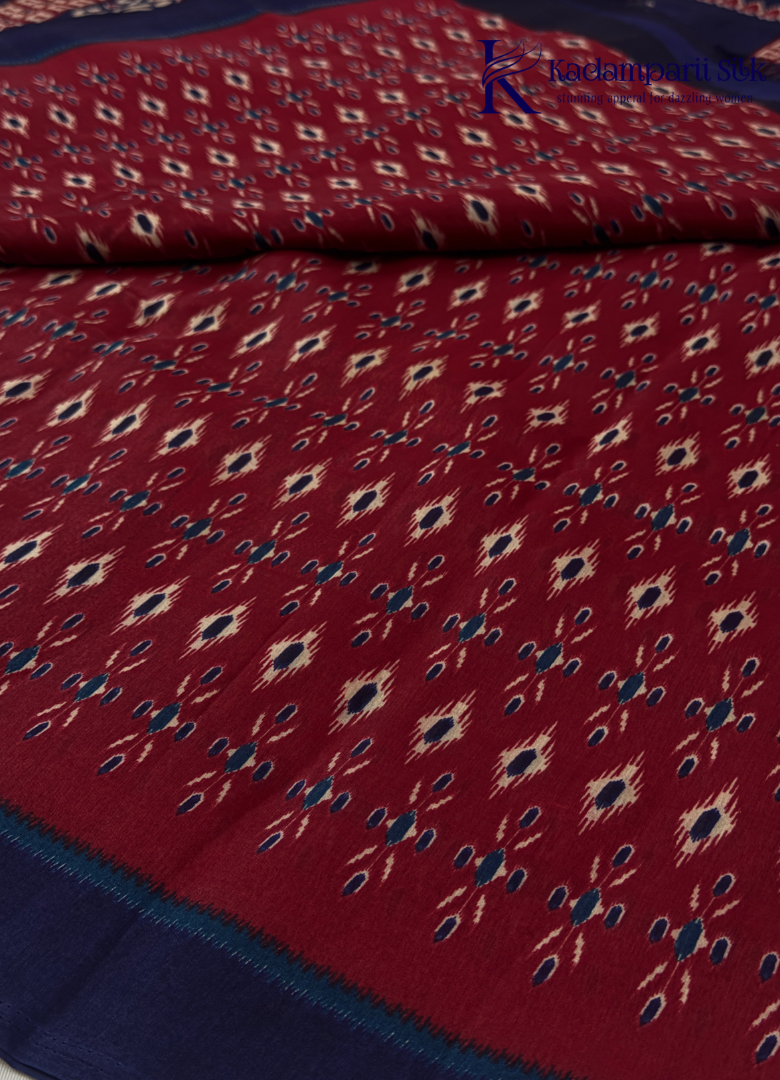 Kadamparii Silk maroon soft semi tussar silk saree with woven pattern and navy blue contrast border, displayed on a white background.