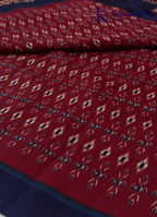 Kadamparii Silk maroon soft semi tussar silk saree with woven pattern and navy blue contrast border, displayed on a white background.