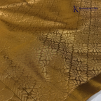 Kadamparii Silk emerald green semi soft silk saree with antique gold zari border, floral woven motifs, rich zari pallu, and elegant tassel detailing.