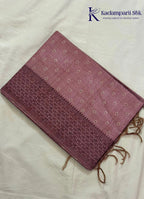 Kadamparii Silk dusty pink semi raw silk saree with butta design and floral border, displayed on a white background.