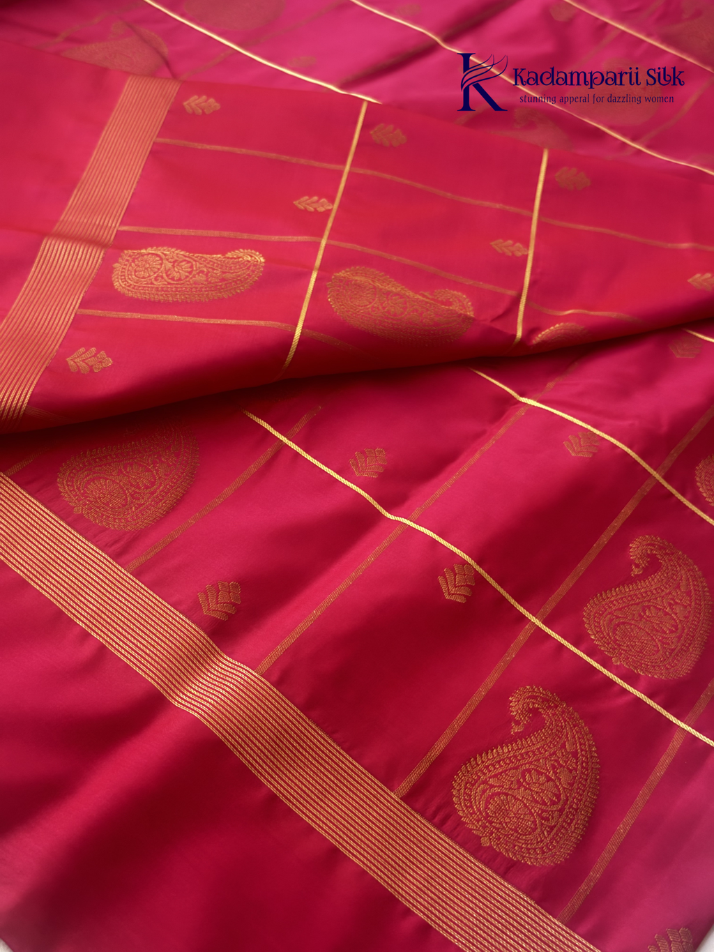 Pink art silk saree with mustard zari border and traditional gold woven motifs displayed on white background Kadamparii Silk