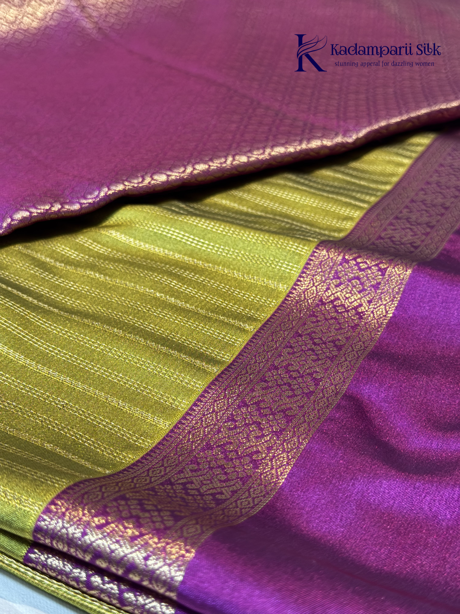 Kadamparii Silk parrot green and magenta semi soft silk saree with gold zari stripes, traditional woven border, rich zari pallu, and tassel detailing.