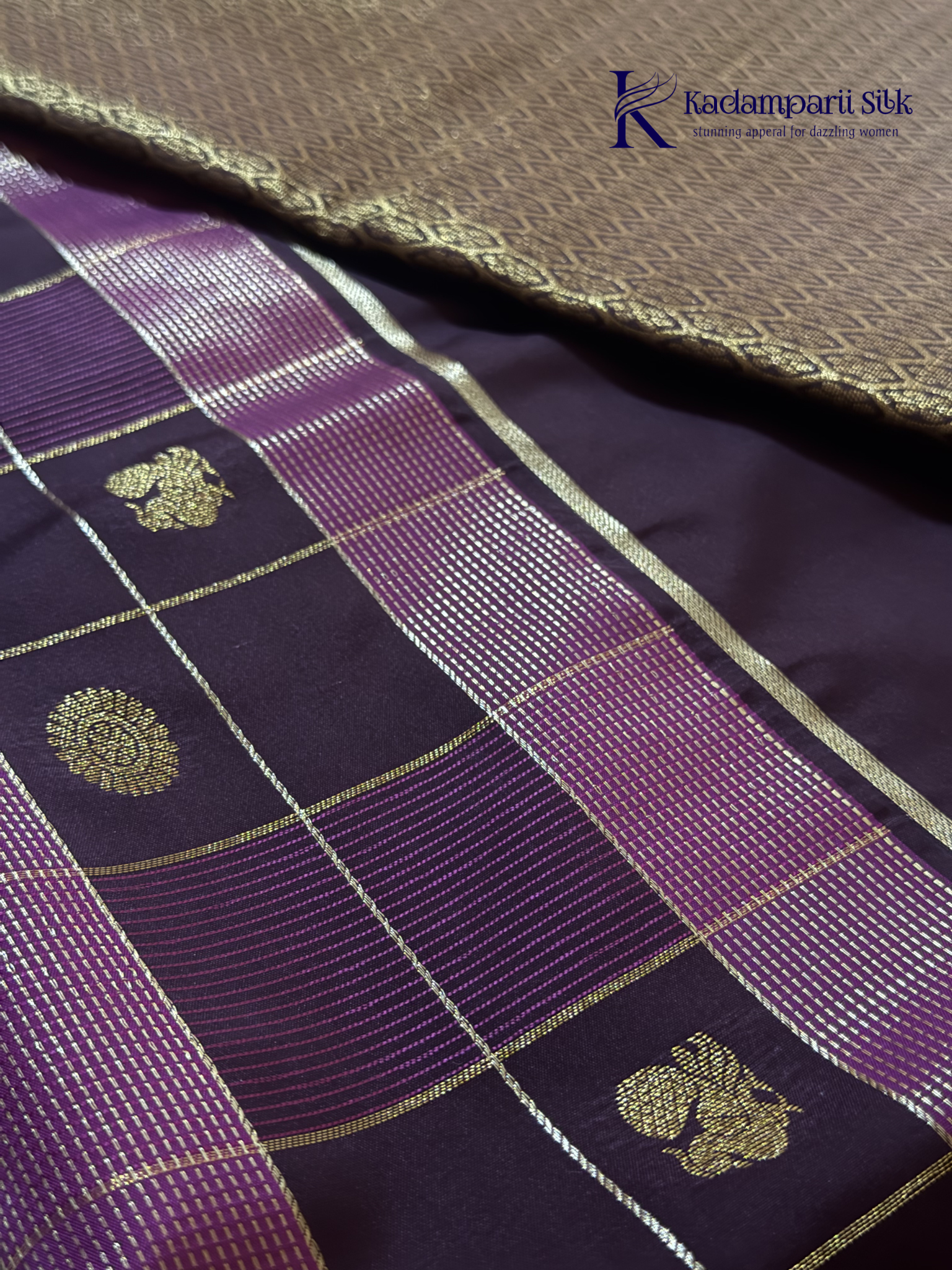 Kadamparii Silk royal wine semi soft silk checked saree with golden zari border, traditional woven pallu, and tassel detailing.