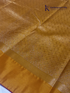 Pink art silk saree with mustard zari border and traditional gold woven motifs displayed on white background Kadamparii Silk