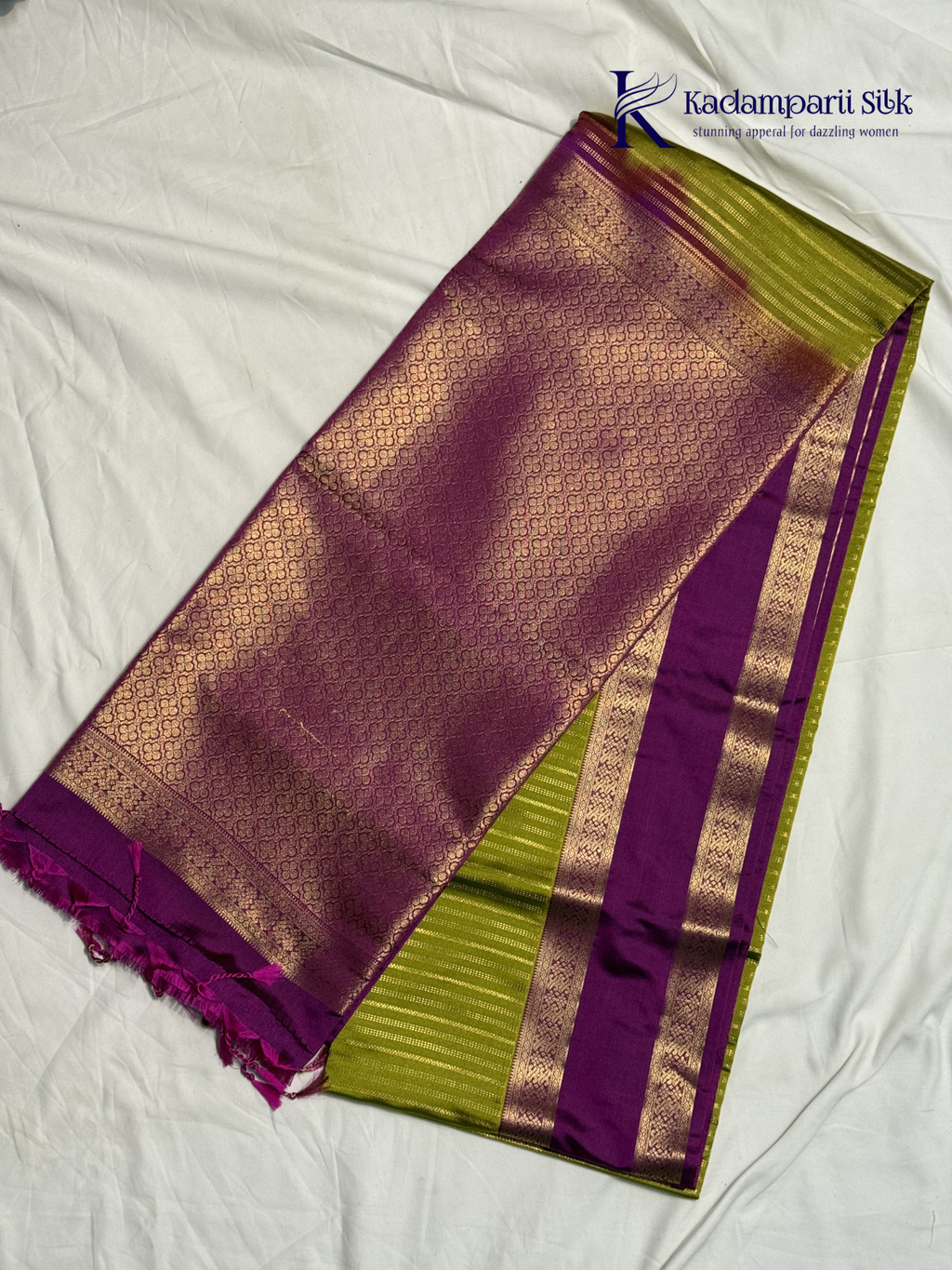 Kadamparii Silk parrot green and magenta semi soft silk saree with gold zari stripes, traditional woven border, rich zari pallu, and tassel detailing.