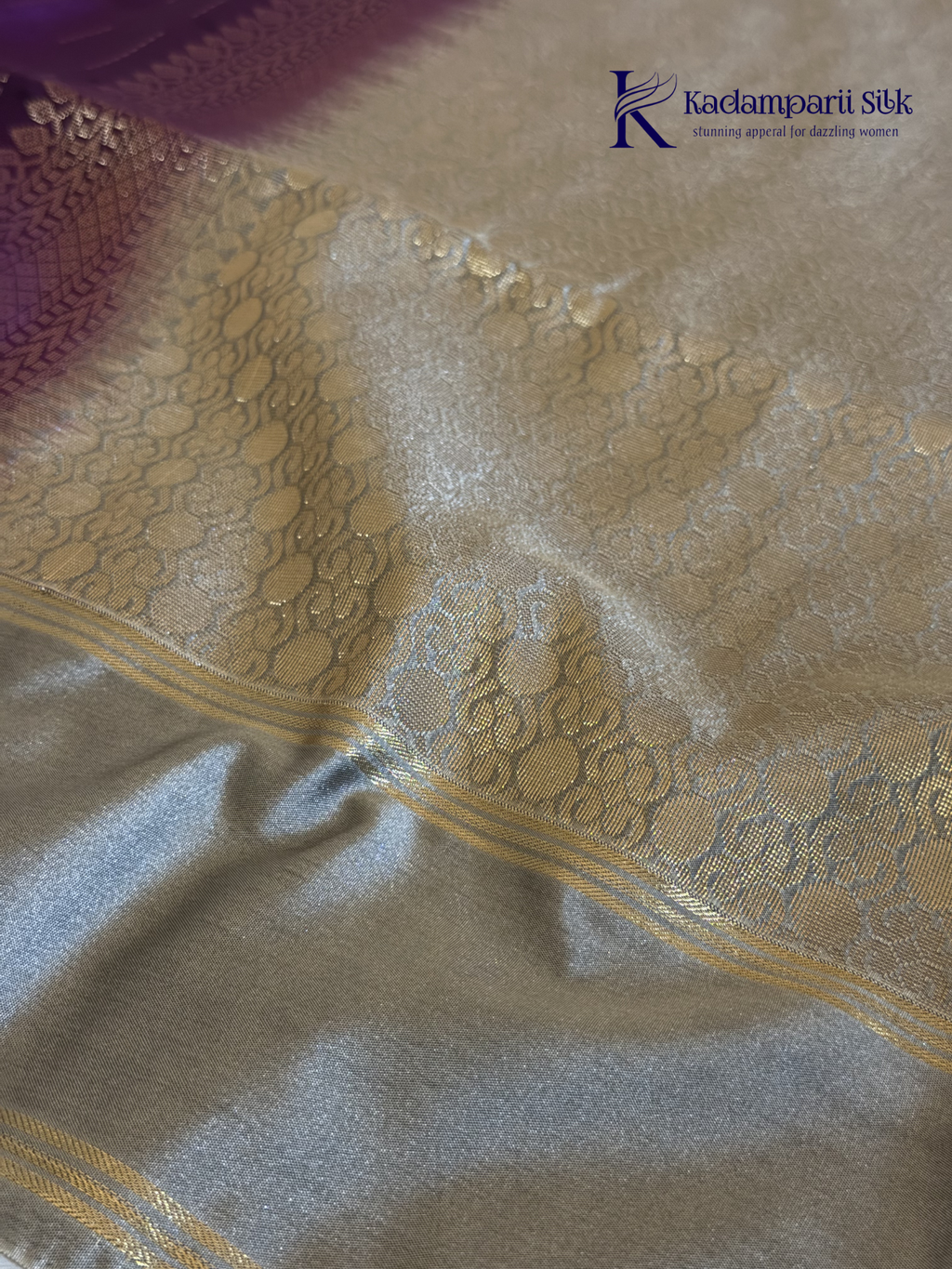 Kadamparii Silk royal purple semi soft silk saree with silver zari woven pallu, floral motifs, elegant border detailing, and tassel finish.