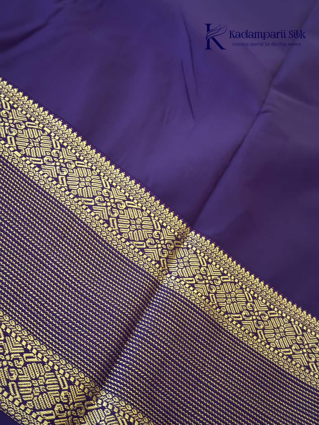 Lavender art silk saree with royal purple zari woven border and gold stripe detailing displayed on white background Kadamparii Silk