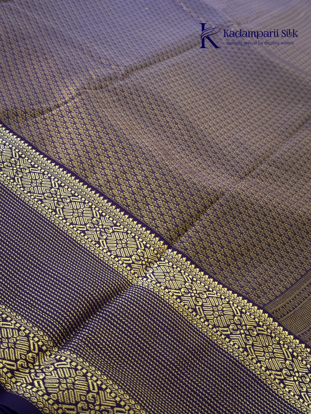 Lavender art silk saree with royal purple zari woven border and gold stripe detailing displayed on white background Kadamparii Silk