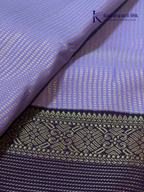 Lavender art silk saree with royal purple zari woven border and gold stripe detailing displayed on white background