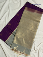 Kadamparii Silk royal purple semi soft silk saree with silver zari woven pallu, floral motifs, elegant border detailing, and tassel finish.
