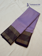 Lavender art silk saree with royal purple zari woven border and gold stripe detailing displayed on white background
