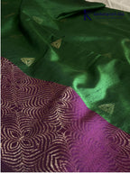 Kadamparii Silk emerald green jute mixed semi soft silk saree with magenta zari woven border, tassels, and gold zari motifs displayed on white background