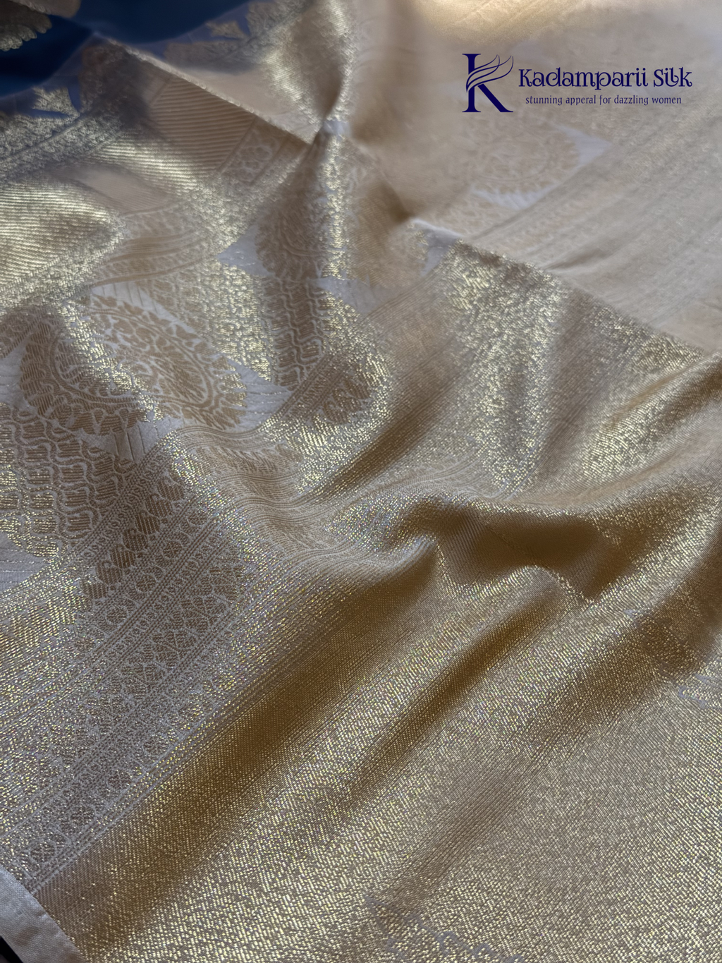 Kadamparii Silk royal navy blue semi soft silk saree with gold zari motifs, paisley design, grand zari woven pallu, and tassel detailing.