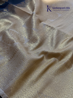 Kadamparii Silk royal navy blue semi soft silk saree with gold zari motifs, paisley design, grand zari woven pallu, and tassel detailing.