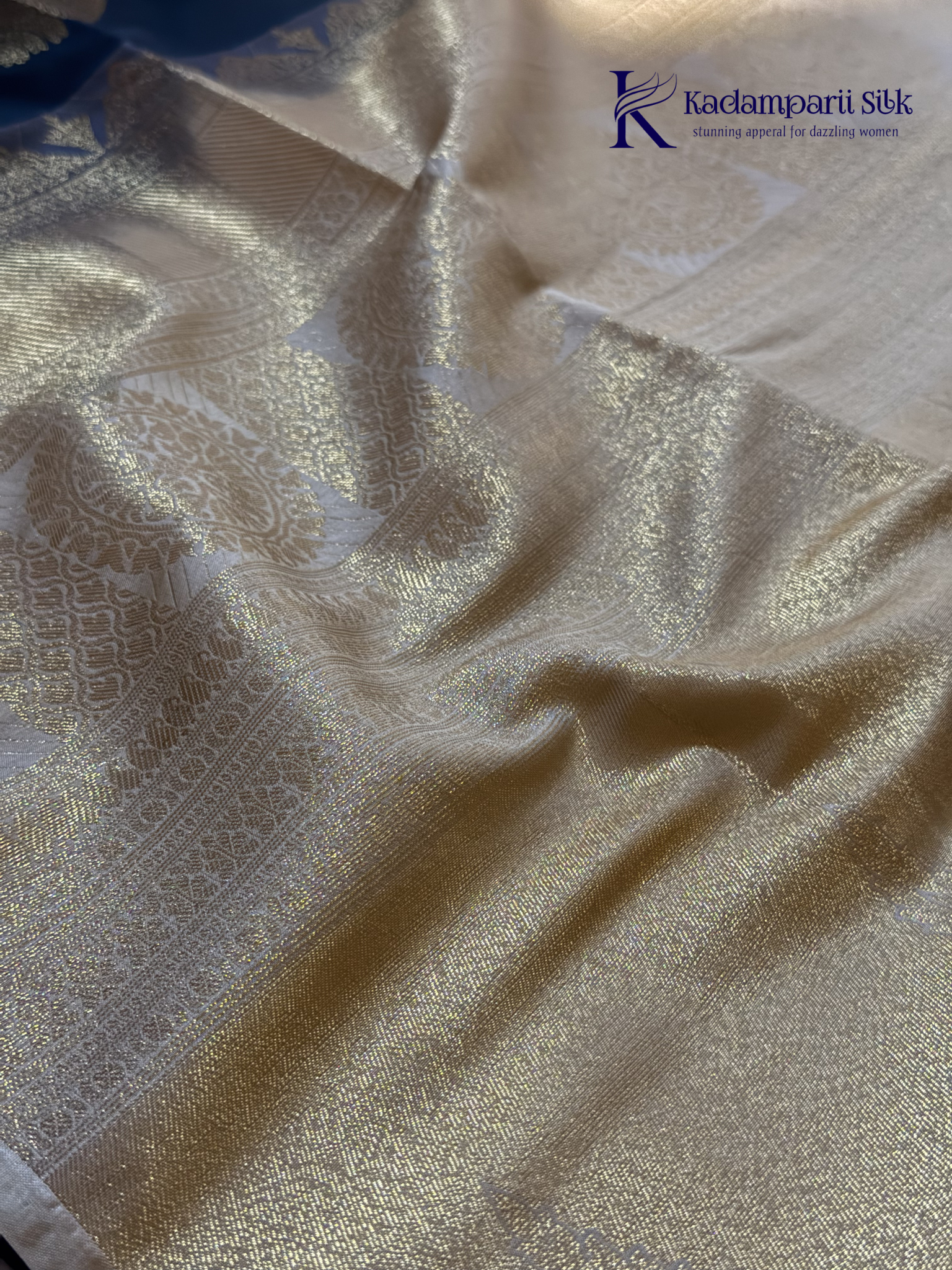 Kadamparii Silk royal navy blue semi soft silk saree with gold zari motifs, paisley design, grand zari woven pallu, and tassel detailing.