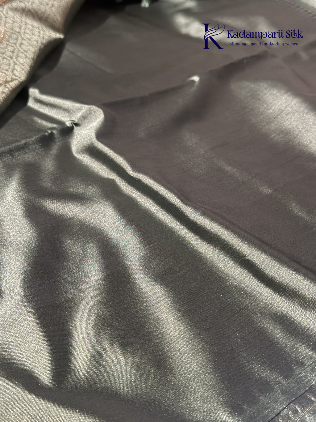 Kadamparii Silk black and sage green semi soft silk saree with gold zari buttas, intricate woven border, rich zari pallu, and tassel detailing.