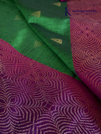 Kadamparii Silk emerald green jute mixed semi soft silk saree with magenta zari woven border, tassels, and gold zari motifs displayed on white background