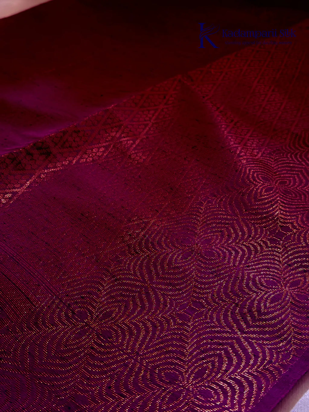 Kadamparii Silk emerald green jute mixed semi soft silk saree with magenta zari woven border, tassels, and gold zari motifs displayed on white background