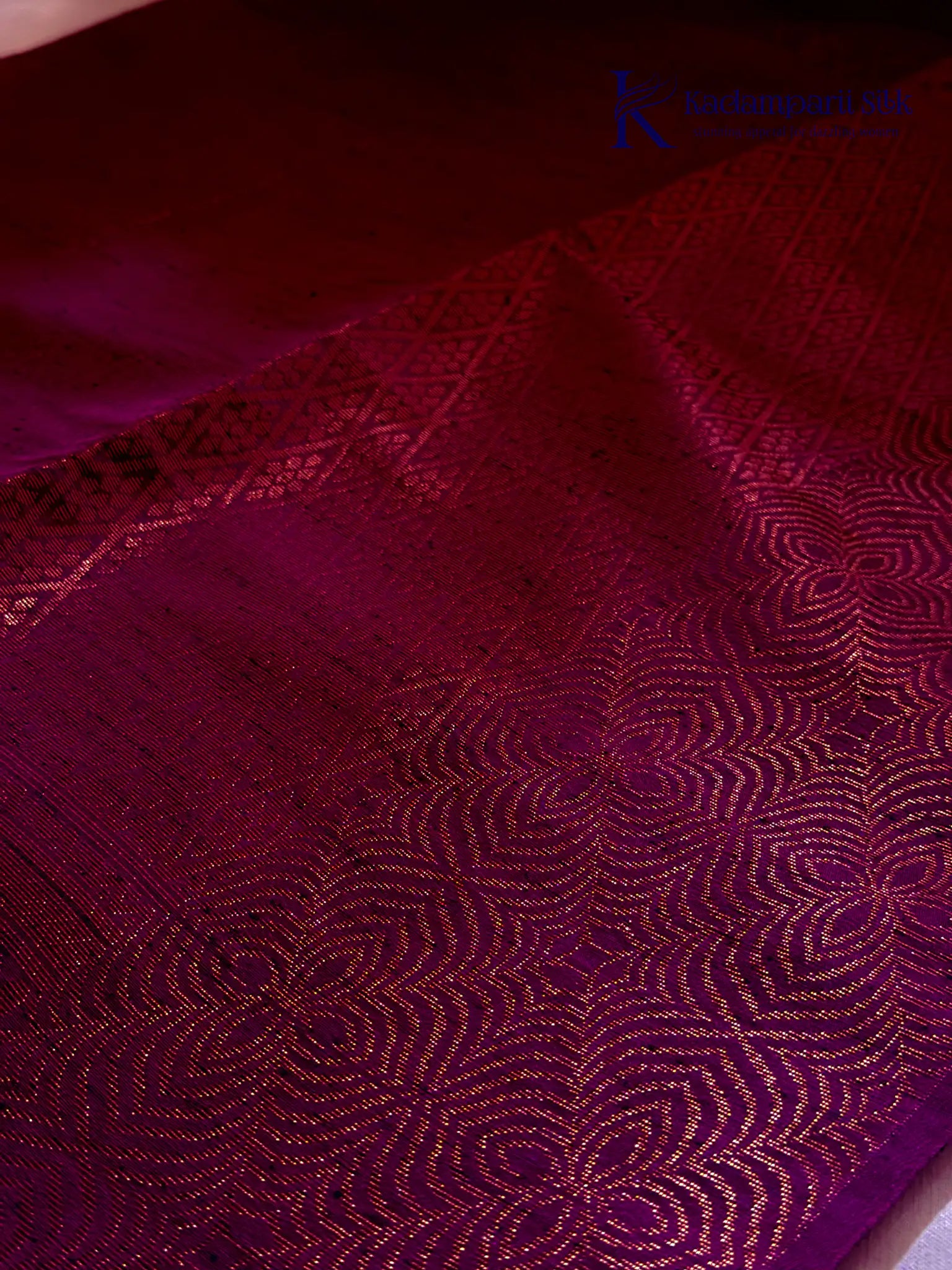 Kadamparii Silk emerald green jute mixed semi soft silk saree with magenta zari woven border, tassels, and gold zari motifs displayed on white background