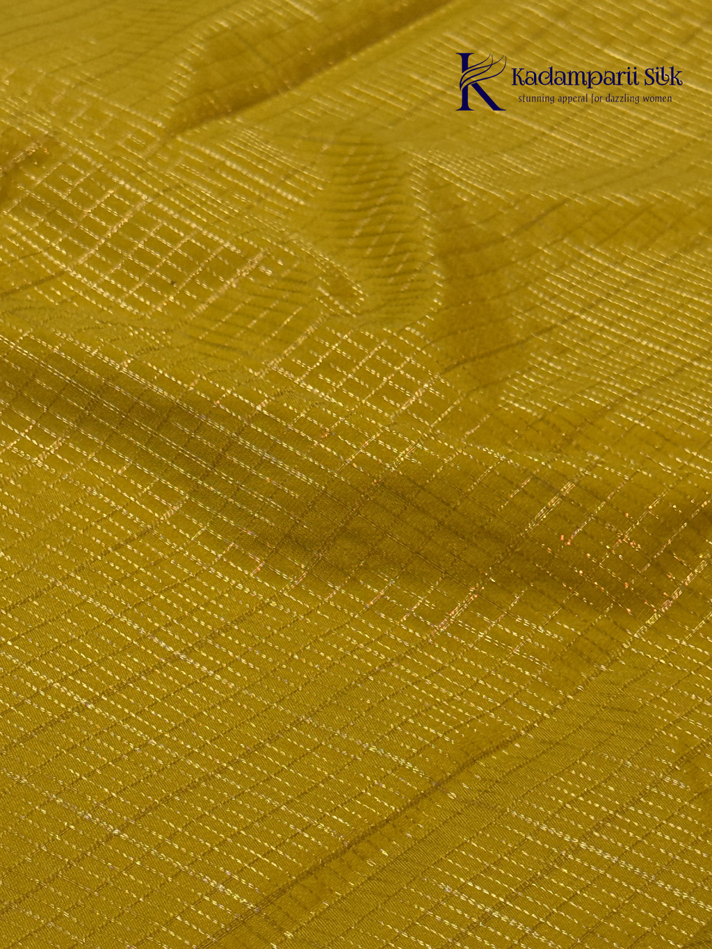 Mustard yellow art silk saree with navy blue floral zari border and textured weave displayed on white background Kadamparii SIlk