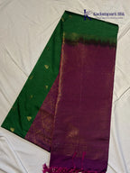 Kadamparii Silk emerald green jute mixed semi soft silk saree with magenta zari woven border, tassels, and gold zari motifs displayed on white background