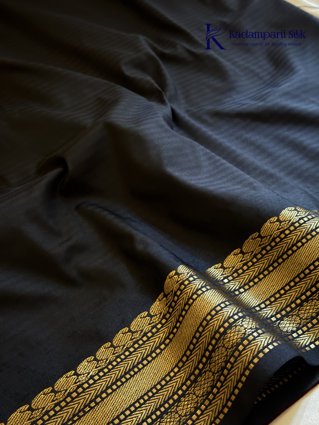 Kadamparii Silk ivory semi soft silk saree with black zari woven border and pallu, intricate traditional patterns, subtle checked texture, and tassel detailing.