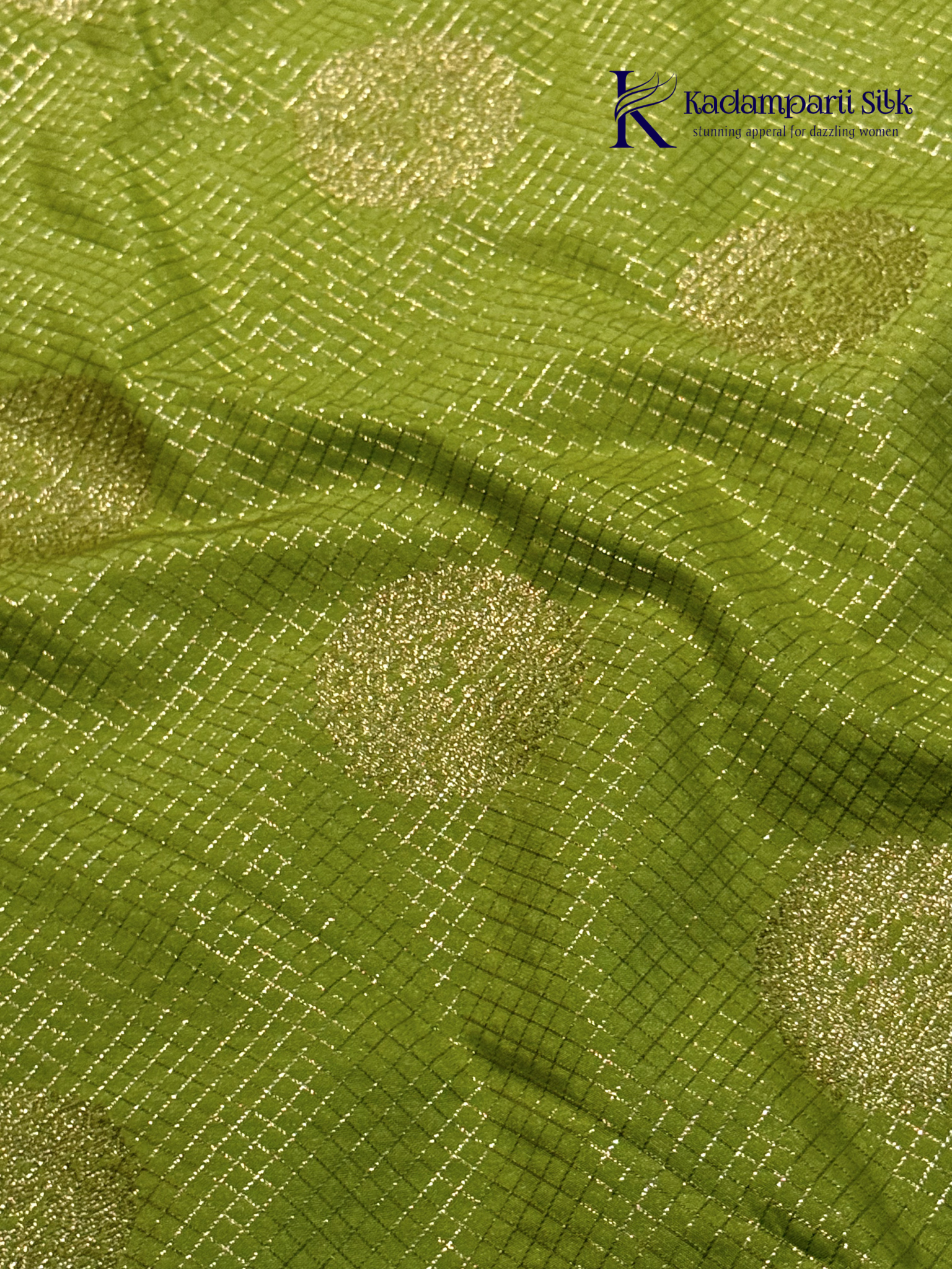 Lime green art silk saree with purple zari border and traditional woven detailing displayed on white background Kadamparii Silk