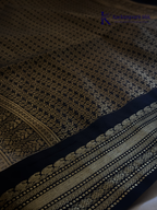 Kadamparii Silk ivory semi soft silk saree with black zari woven border and pallu, intricate traditional patterns, subtle checked texture, and tassel detailing.
