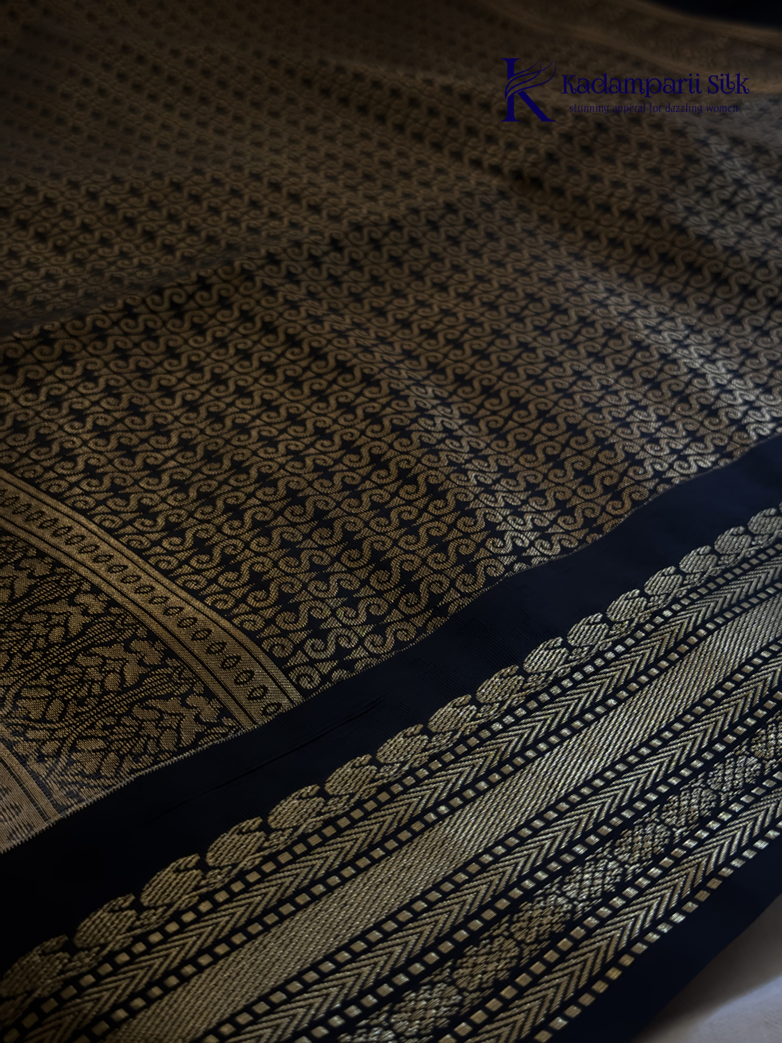 Kadamparii Silk ivory semi soft silk saree with black zari woven border and pallu, intricate traditional patterns, subtle checked texture, and tassel detailing.
