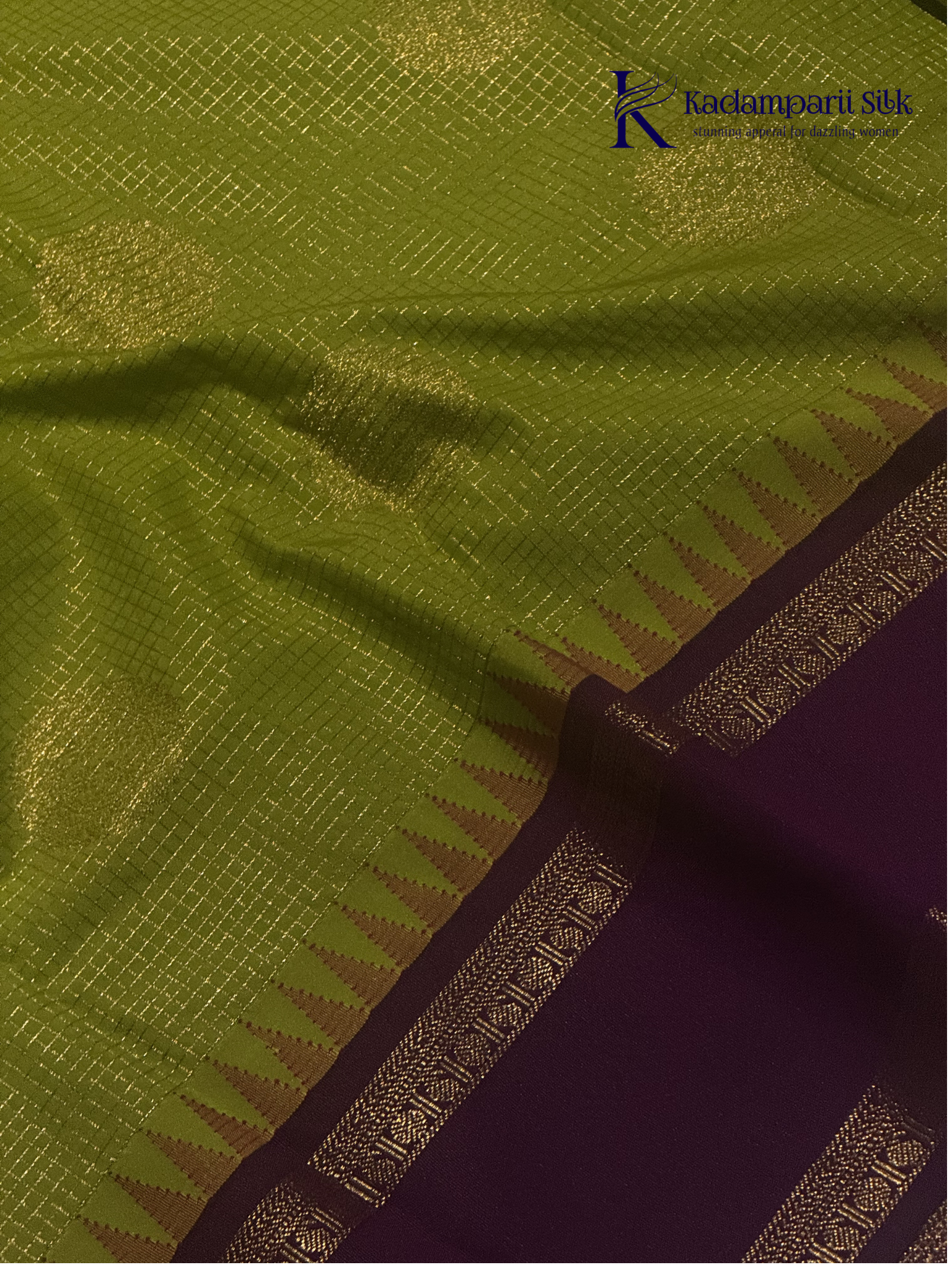 Lime green art silk saree with purple zari border and traditional woven detailing displayed on white background Kadamparii Silk