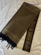 Kadamparii Silk ivory semi soft silk saree with black zari woven border and pallu, intricate traditional patterns, subtle checked texture, and tassel detailing.