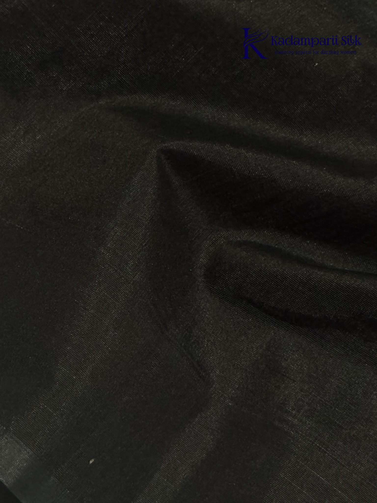 Wine silk cotton saree with black zari woven pallu and gold zari detailing displayed on white background