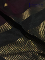 Wine silk cotton saree with black zari woven pallu and gold zari detailing displayed on white background