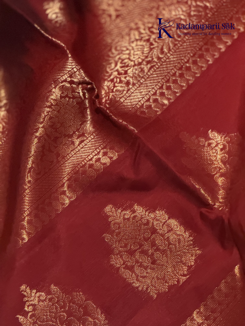 Close-up of red fabric with gold intricate patterns, Kadamparii Silk
